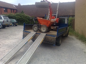 micro and pedstrian dumer loaded on lorry